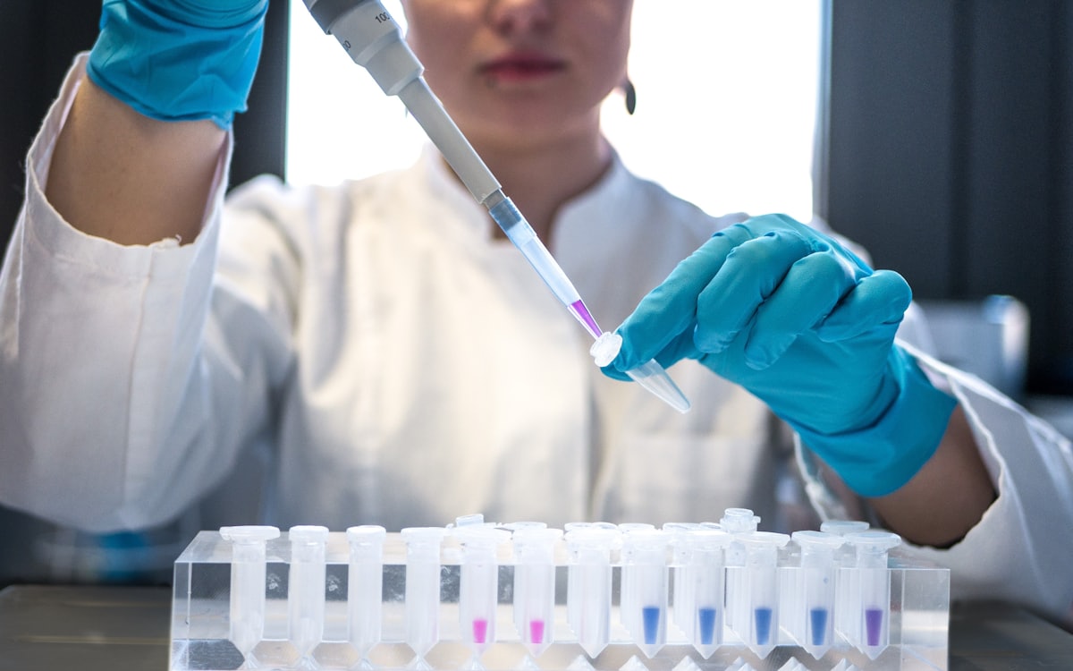 Scientist pipetting peptide samples